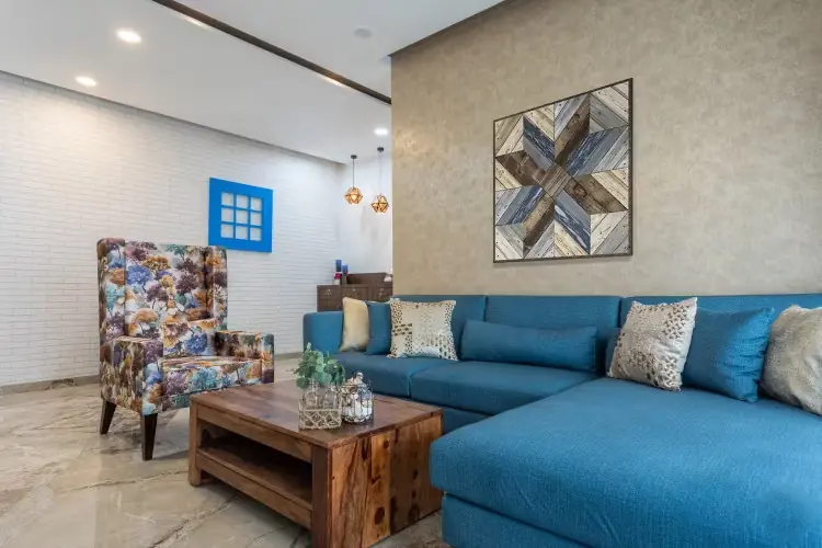 Living room with blue sofa and gallery wall